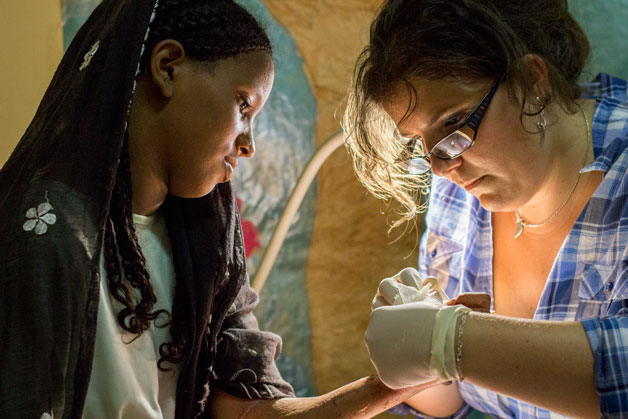 Elodie working with a patient at CURE Niger