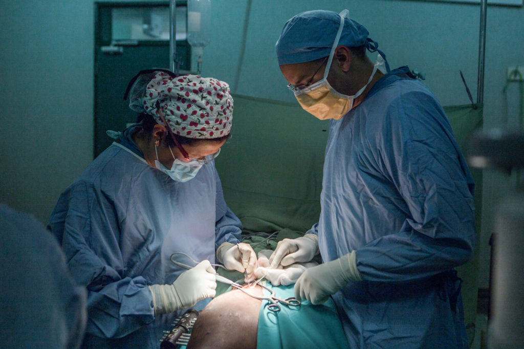 Surgeons operating.